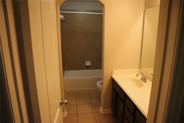a bathroom with a shower and a sink