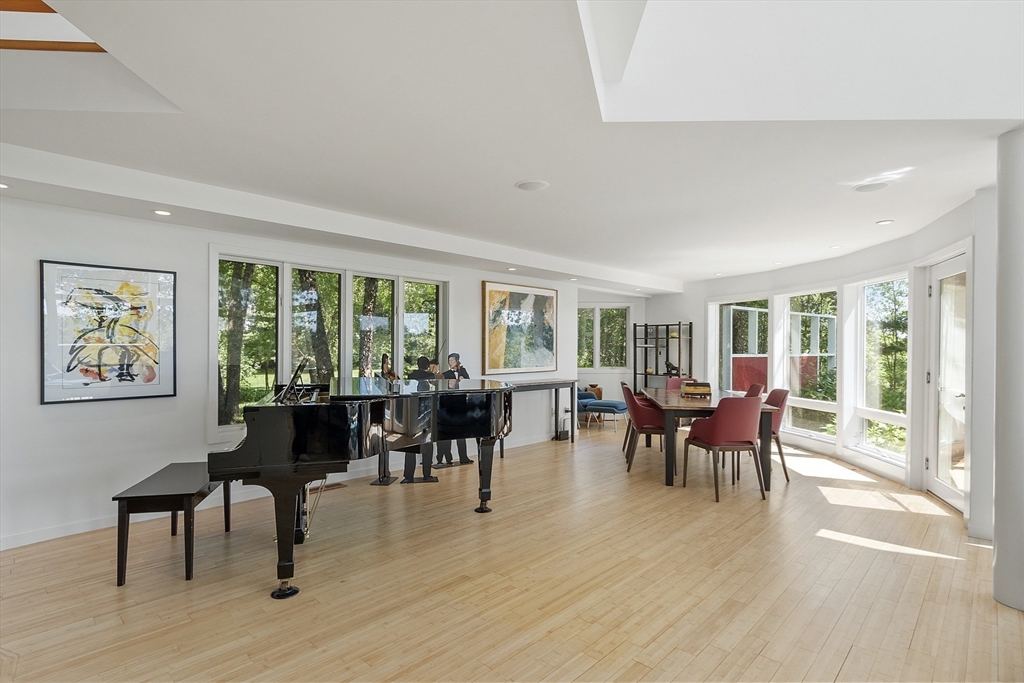 389 River Road Carlisle, MA 01741 - Photo 12 of 42 a view of a dining room with furniture window and outside view