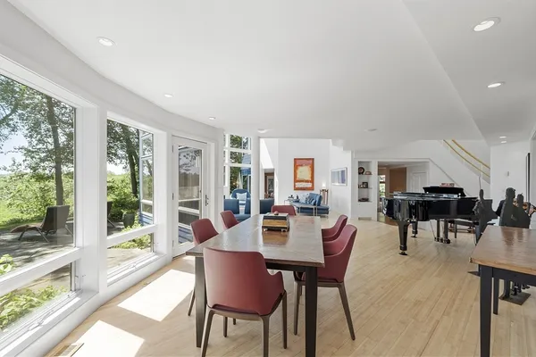 a view of a dining room with furniture window and outside view