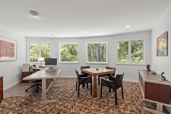 a view of a dining room with furniture window and outside view