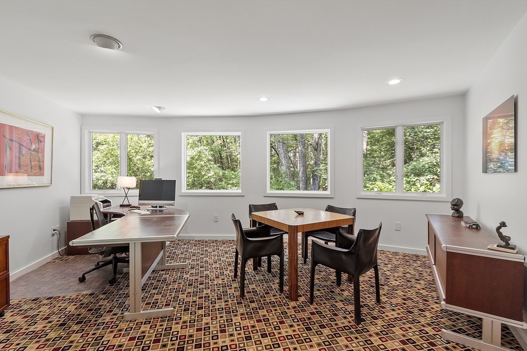 389 River Road Carlisle, MA 01741 - Photo 26 of 42 a view of a dining room with furniture window and outside view