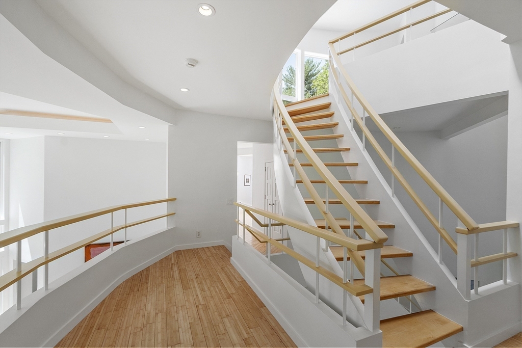 389 River Road Carlisle, MA 01741 - Photo 29 of 42 a view of staircase with railing and white walls