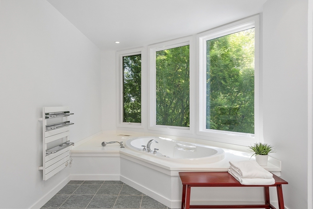 389 River Road Carlisle, MA 01741 - Photo 32 of 42 a bathroom with a sink and a bathtub