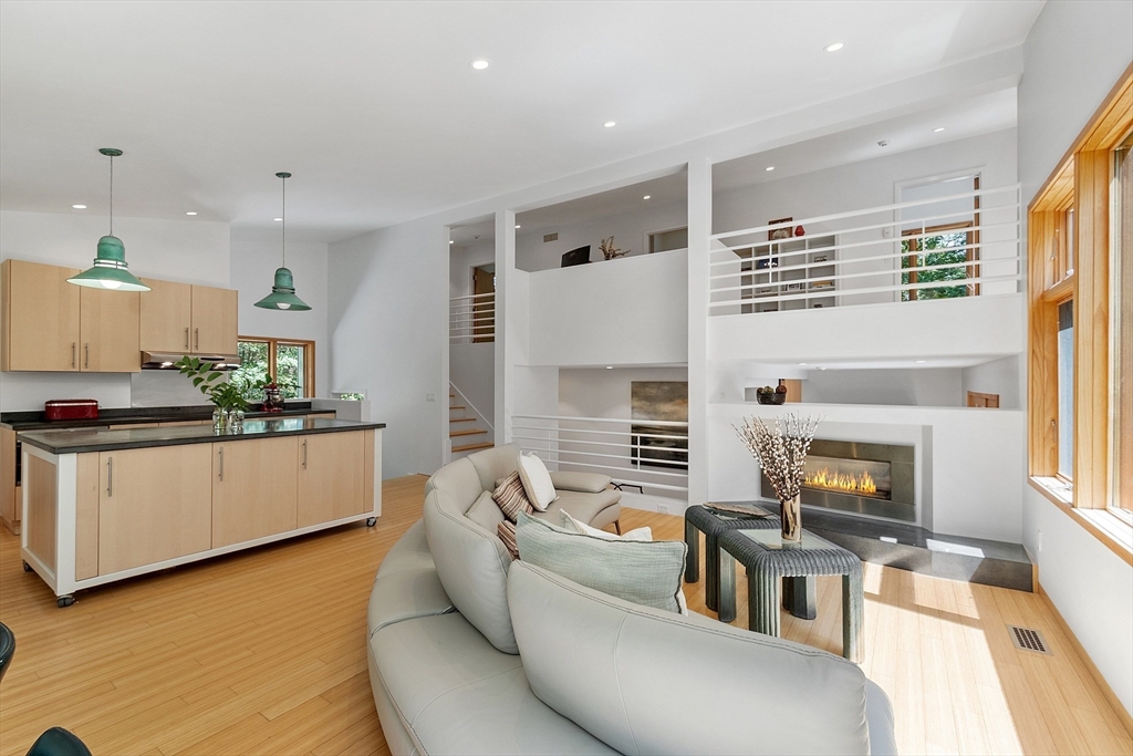 389 River Road Carlisle, MA 01741 - Photo 39 of 42 a living room with furniture and a fireplace