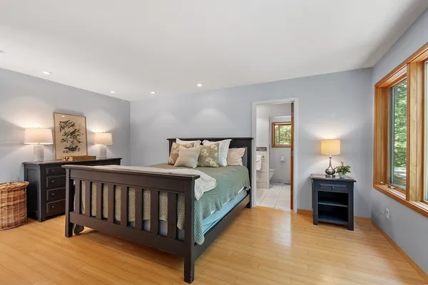 a bed room with a bed and a window