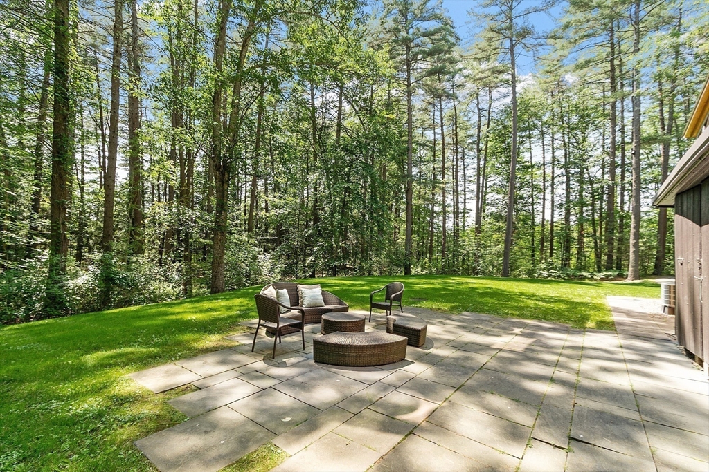389 River Road Carlisle, MA 01741 - Photo 42 of 42 a view of a backyard with sitting area