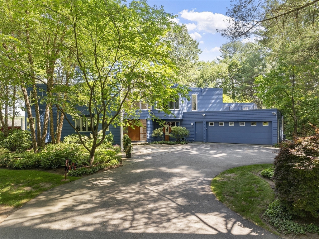 389 River Road Carlisle, MA 01741 - Photo 6 of 42 a view of a house with a yard and large trees