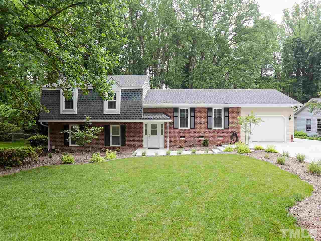 7316 Harps Mill Road Raleigh, NC 27615 - Photo 1 of 25 front view of a house with a big yard
