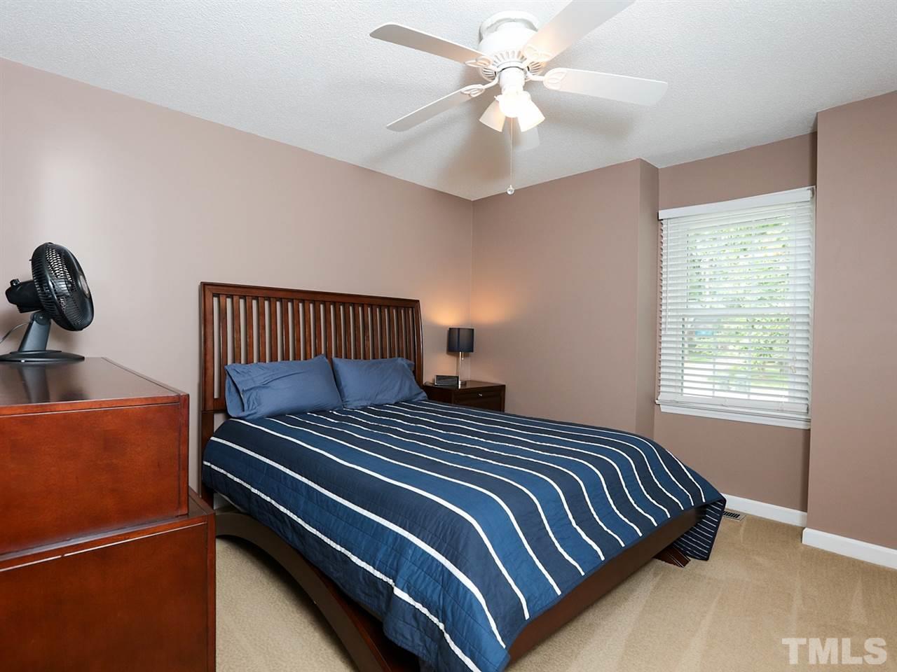 7316 Harps Mill Road Raleigh, NC 27615 - Photo 14 of 25 a bedroom with bed and window