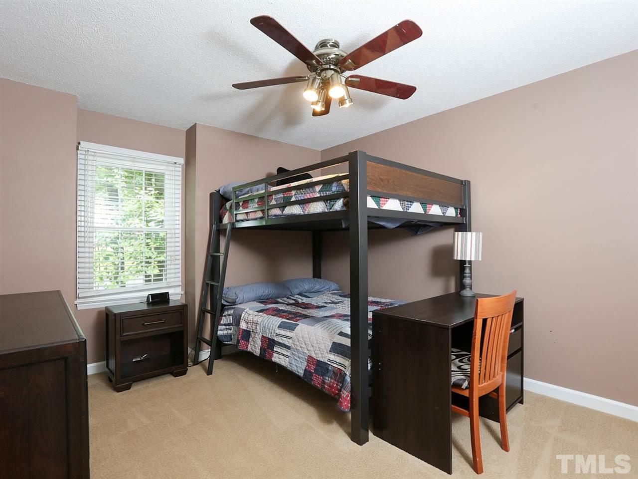 7316 Harps Mill Road Raleigh, NC 27615 - Photo 15 of 25 a bedroom with bed and a window
