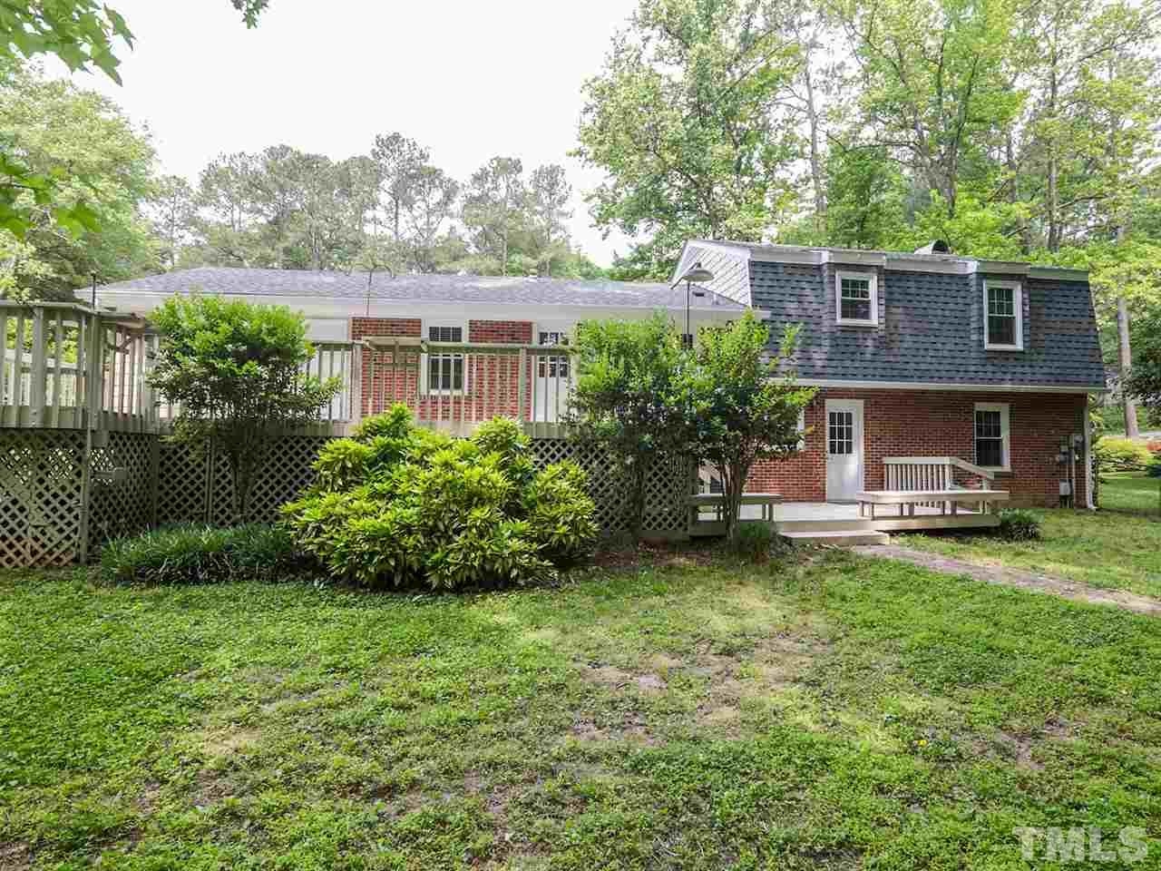 7316 Harps Mill Road Raleigh, NC 27615 - Photo 22 of 25 a view of a house with a yard and sitting area