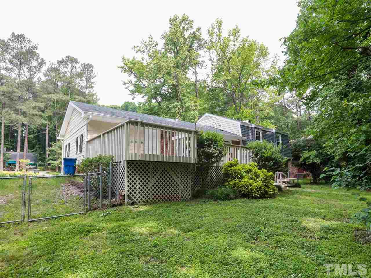 7316 Harps Mill Road Raleigh, NC 27615 - Photo 23 of 25 a front view of a house with garden