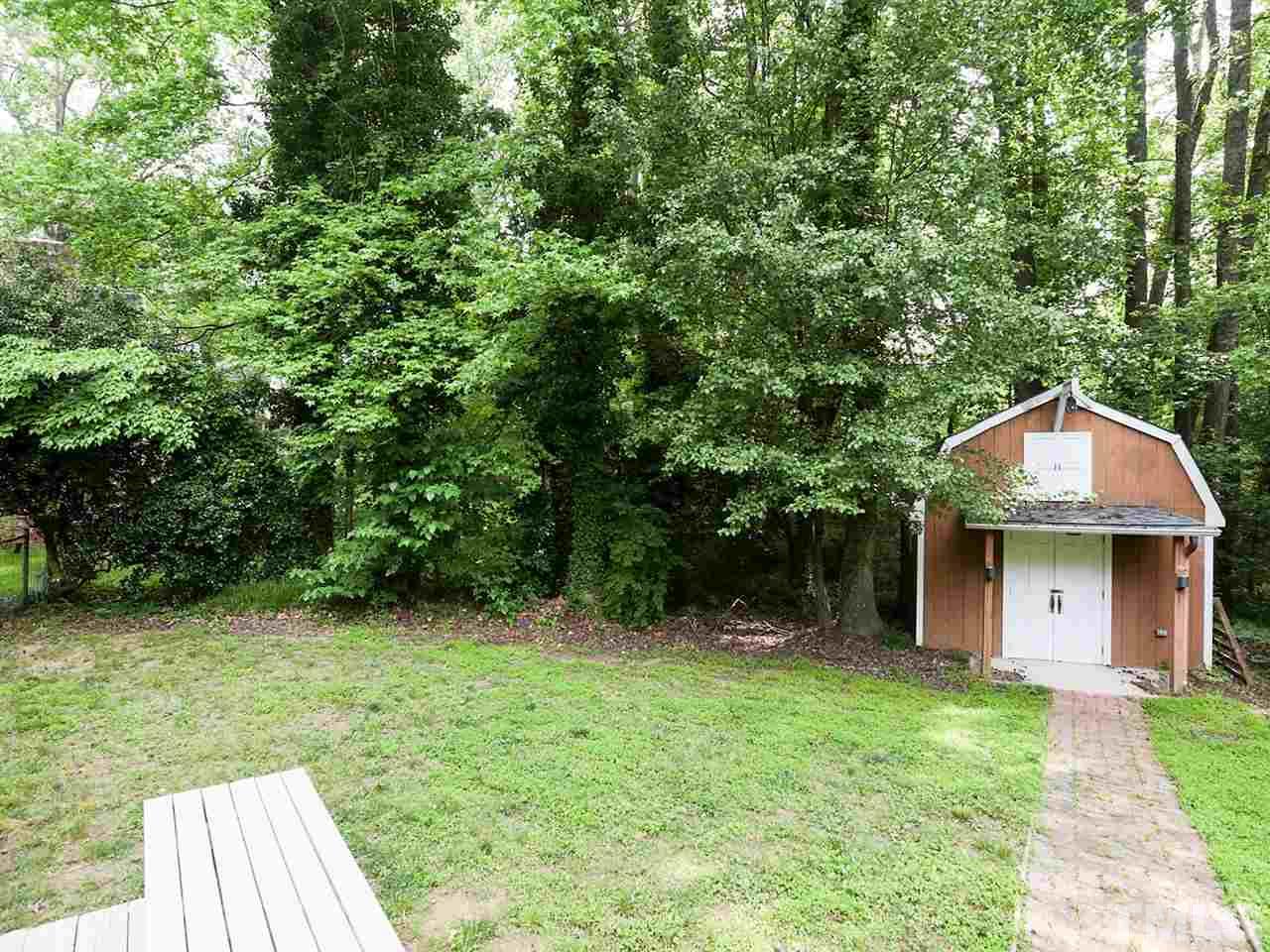7316 Harps Mill Road Raleigh, NC 27615 - Photo 24 of 25 a view of a house with backyard and garden