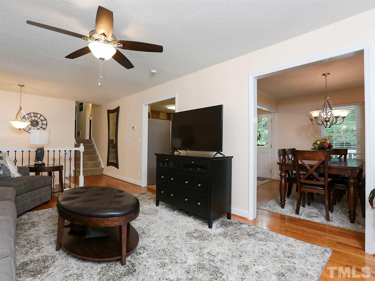 7316 Harps Mill Road Raleigh, NC 27615 - Photo 7 of 25 a living room with furniture and a flat screen tv