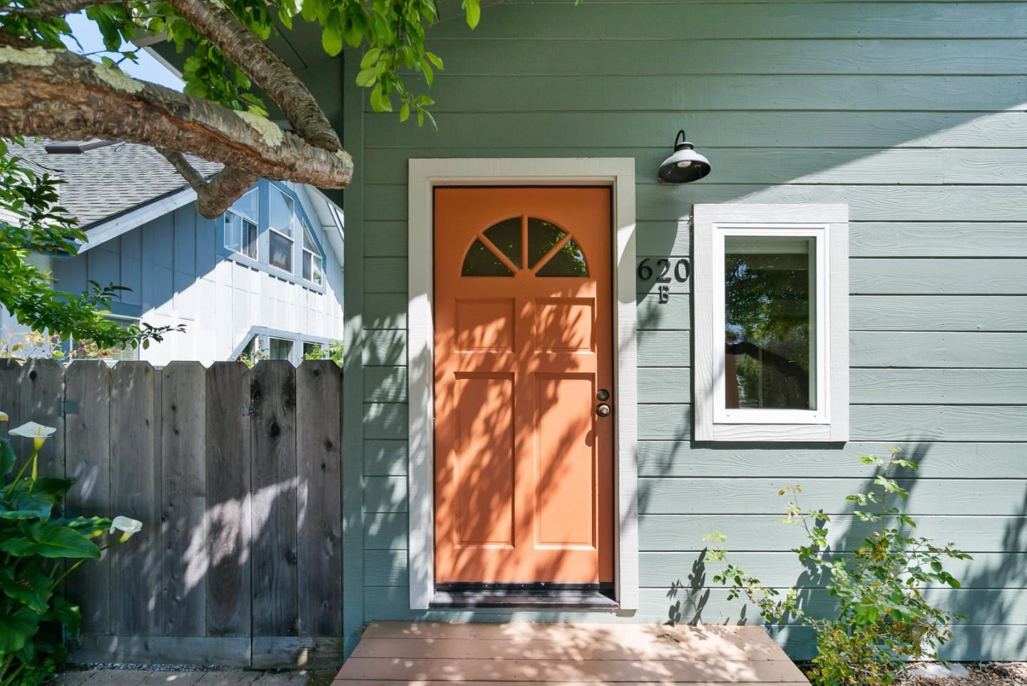 620 Sumner Street Santa Cruz, CA 95062 - Photo 25 of 45 a view of a house with a small yard and wooden floor and fence