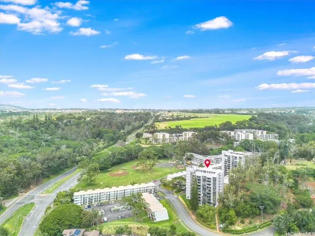 a view of a balcony with yard