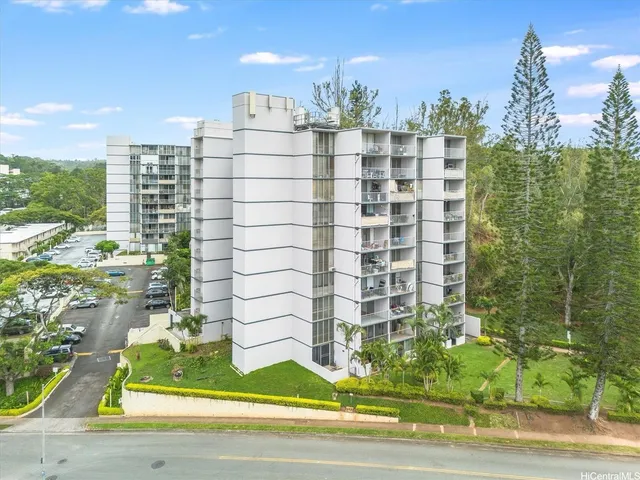 a view of a balcony with yard