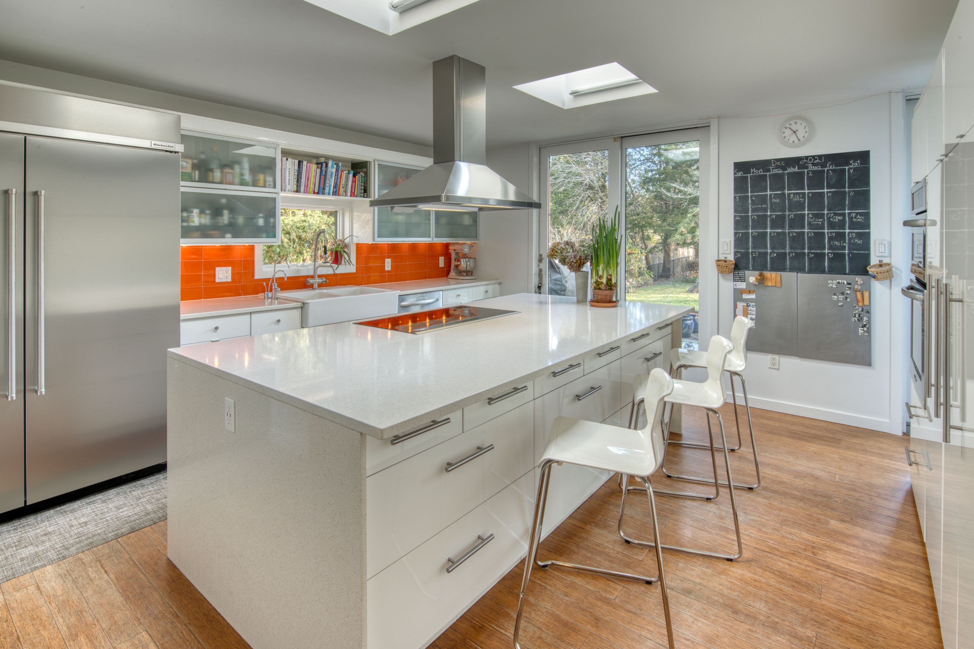Undisclosed Address Sag Harbor, NY 11963 - Photo 1 of 18 a kitchen with stainless steel appliances cabinets and a table