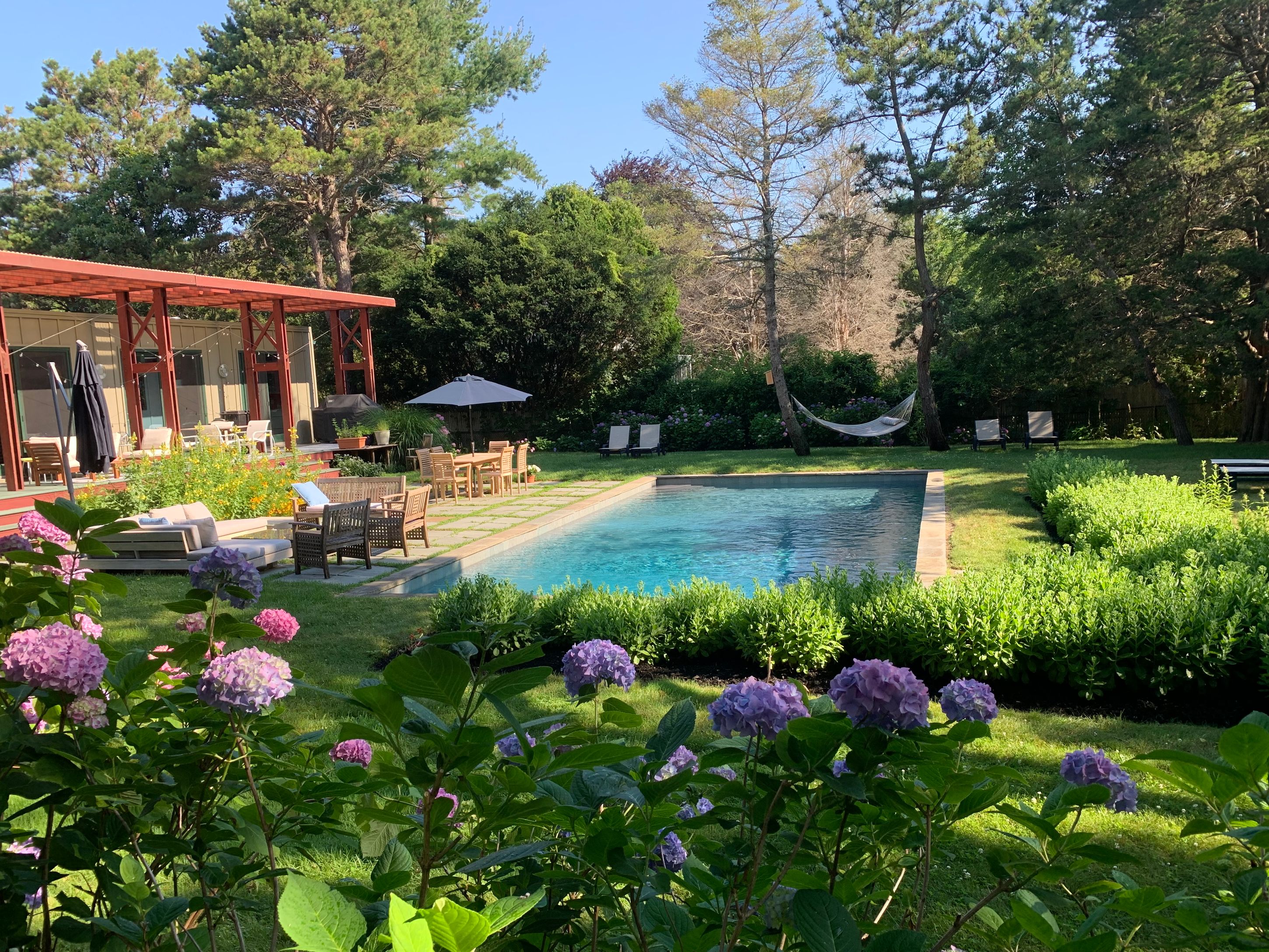 Undisclosed Address Sag Harbor, NY 11963 - Photo 13 of 18 a view of a house with a yard and garden
