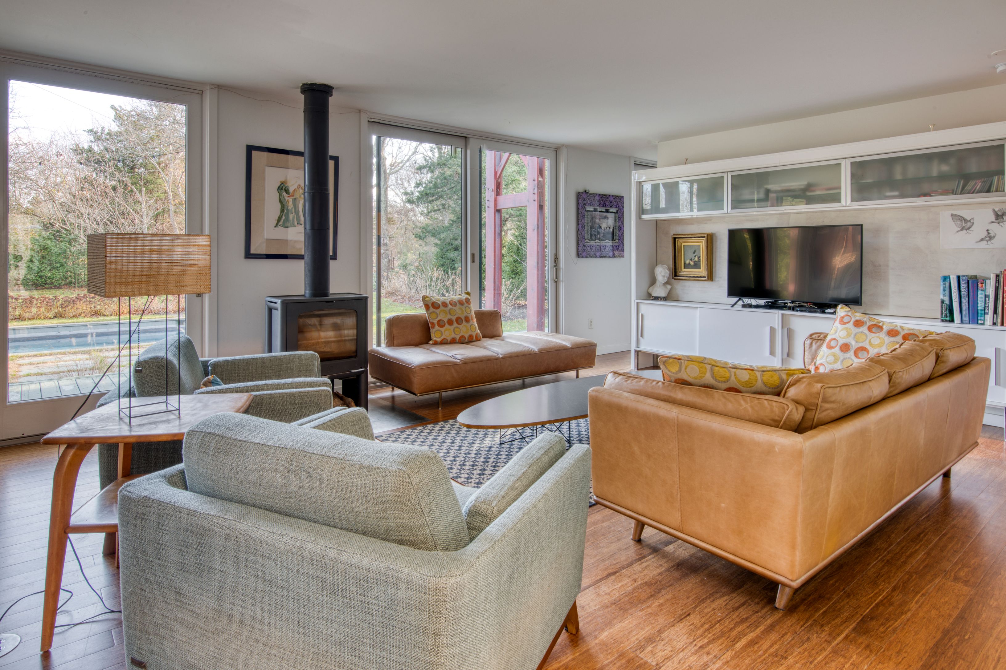 Undisclosed Address Sag Harbor, NY 11963 - Photo 2 of 18 a living room with furniture and a flat screen tv