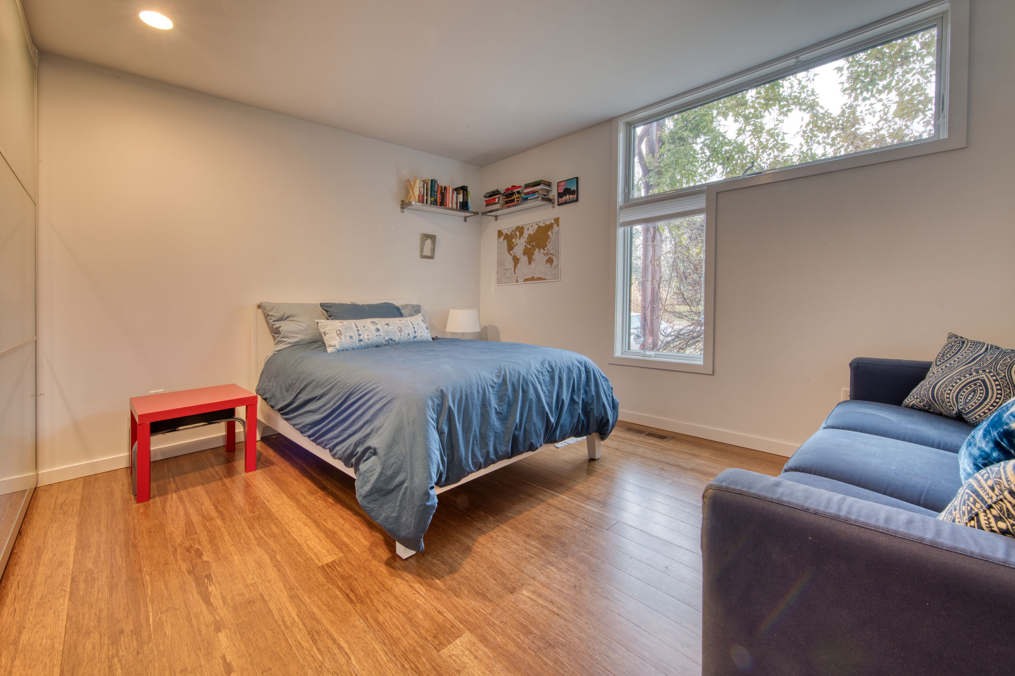 Undisclosed Address Sag Harbor, NY 11963 - Photo 8 of 18 a bedroom with a bed and a dresser next to a window