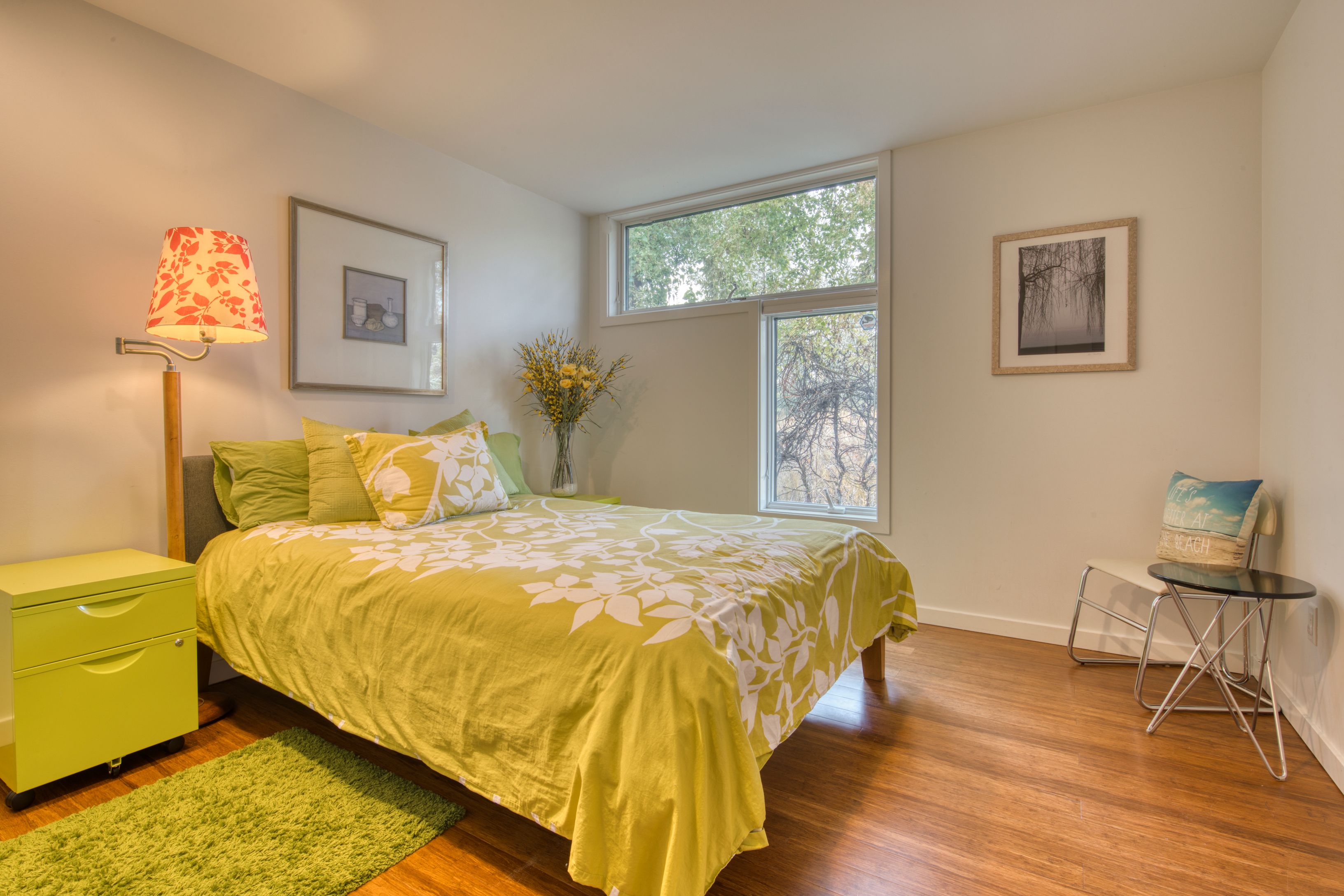 Undisclosed Address Sag Harbor, NY 11963 - Photo 9 of 18 a bedroom with a bed and painting on the wall