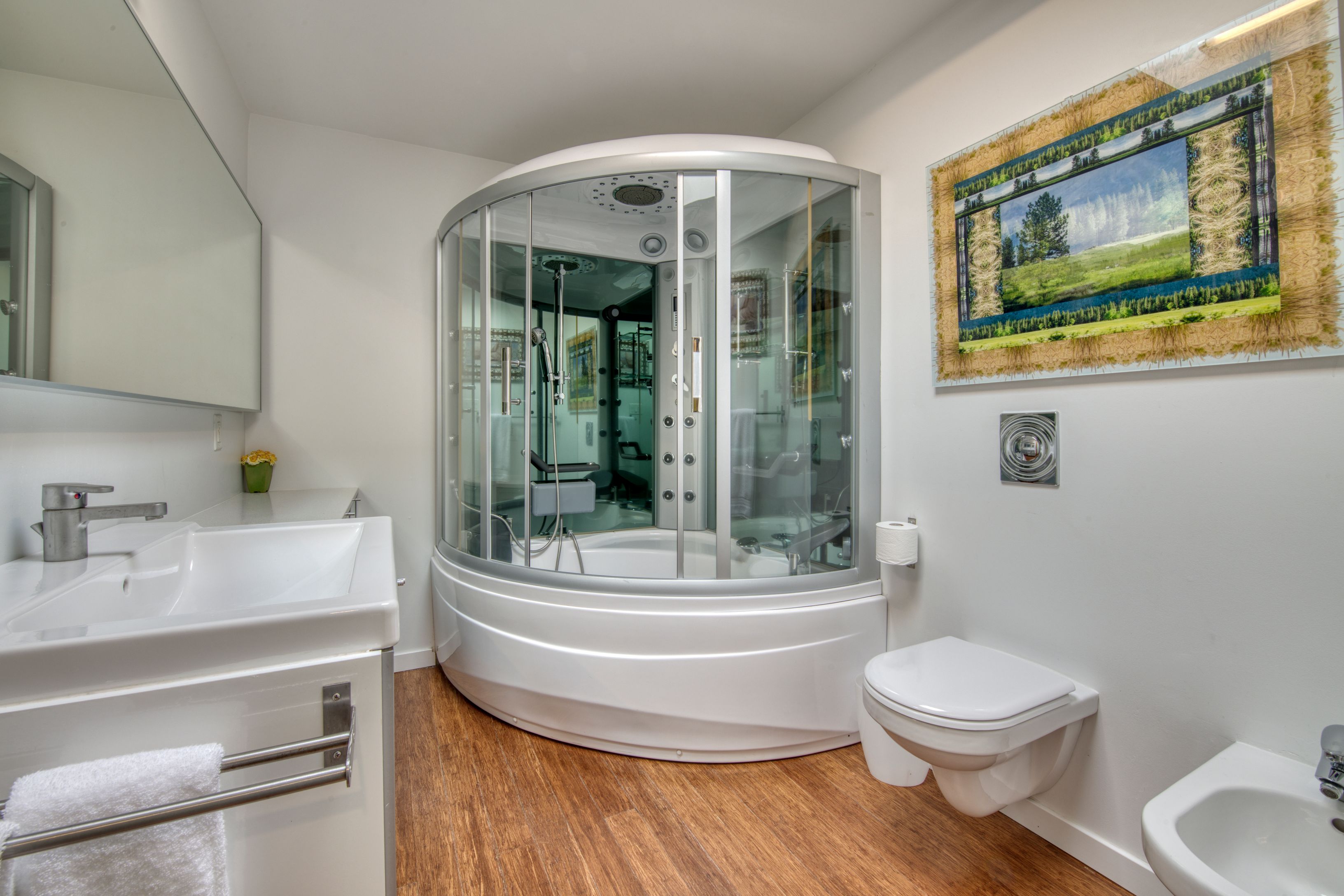 Undisclosed Address Sag Harbor, NY 11963 - Photo 10 of 18 a bathroom with a toilet a sink and mirror