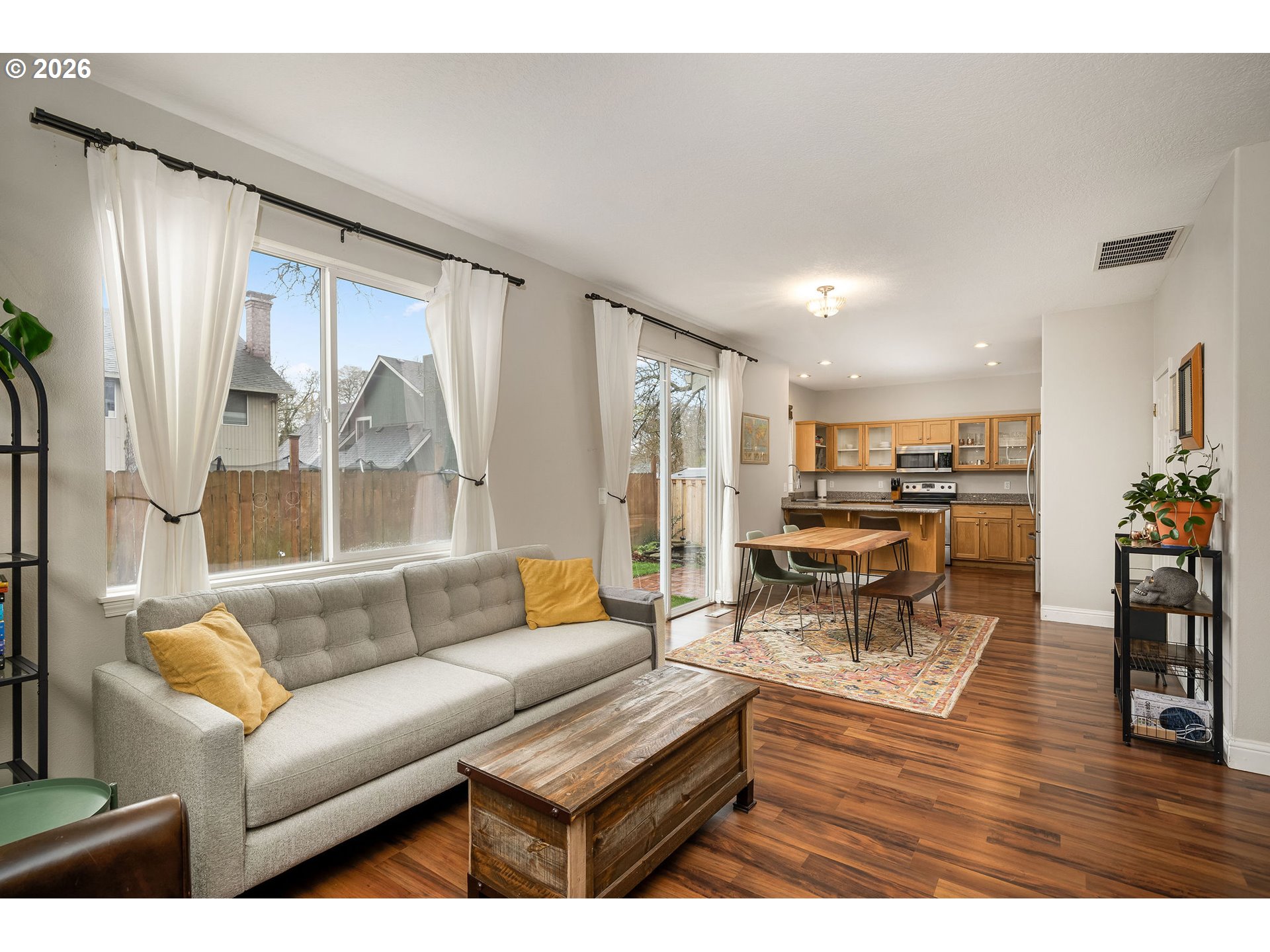8330 Southwest Norfolk Lane Portland, OR 97224 - Photo 11 of 37 a living room with furniture and a large window