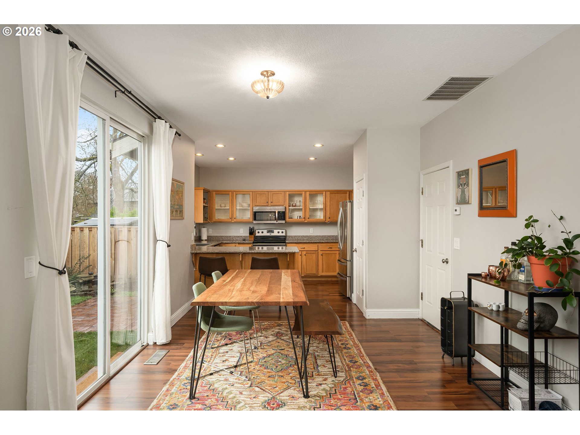 8330 Southwest Norfolk Lane Portland, OR 97224 - Photo 14 of 37 a dining room with furniture and wooden floor