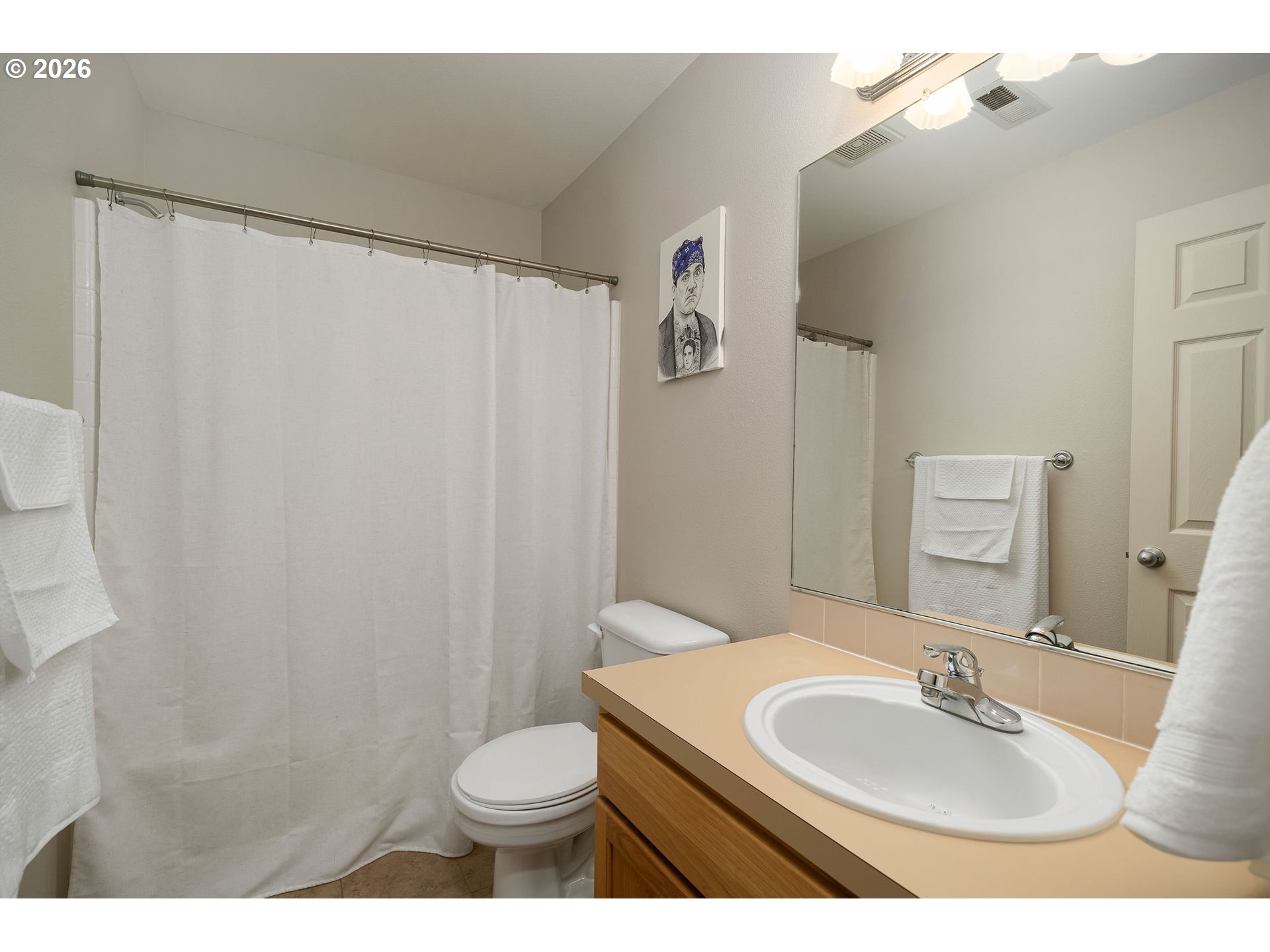 8330 Southwest Norfolk Lane Portland, OR 97224 - Photo 28 of 37 a bathroom with a sink a toilet and a mirror