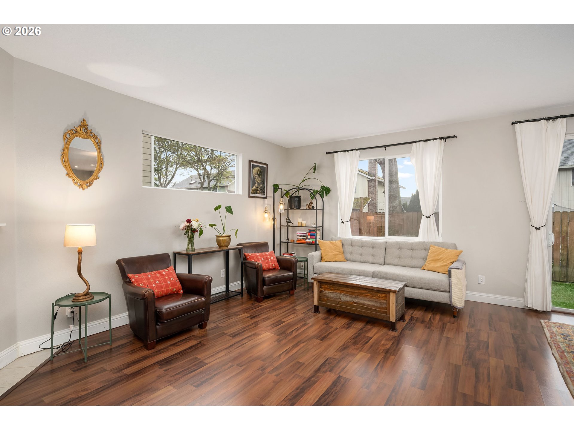 8330 Southwest Norfolk Lane Portland, OR 97224 - Photo 8 of 37 a living room with furniture and a wooden floor