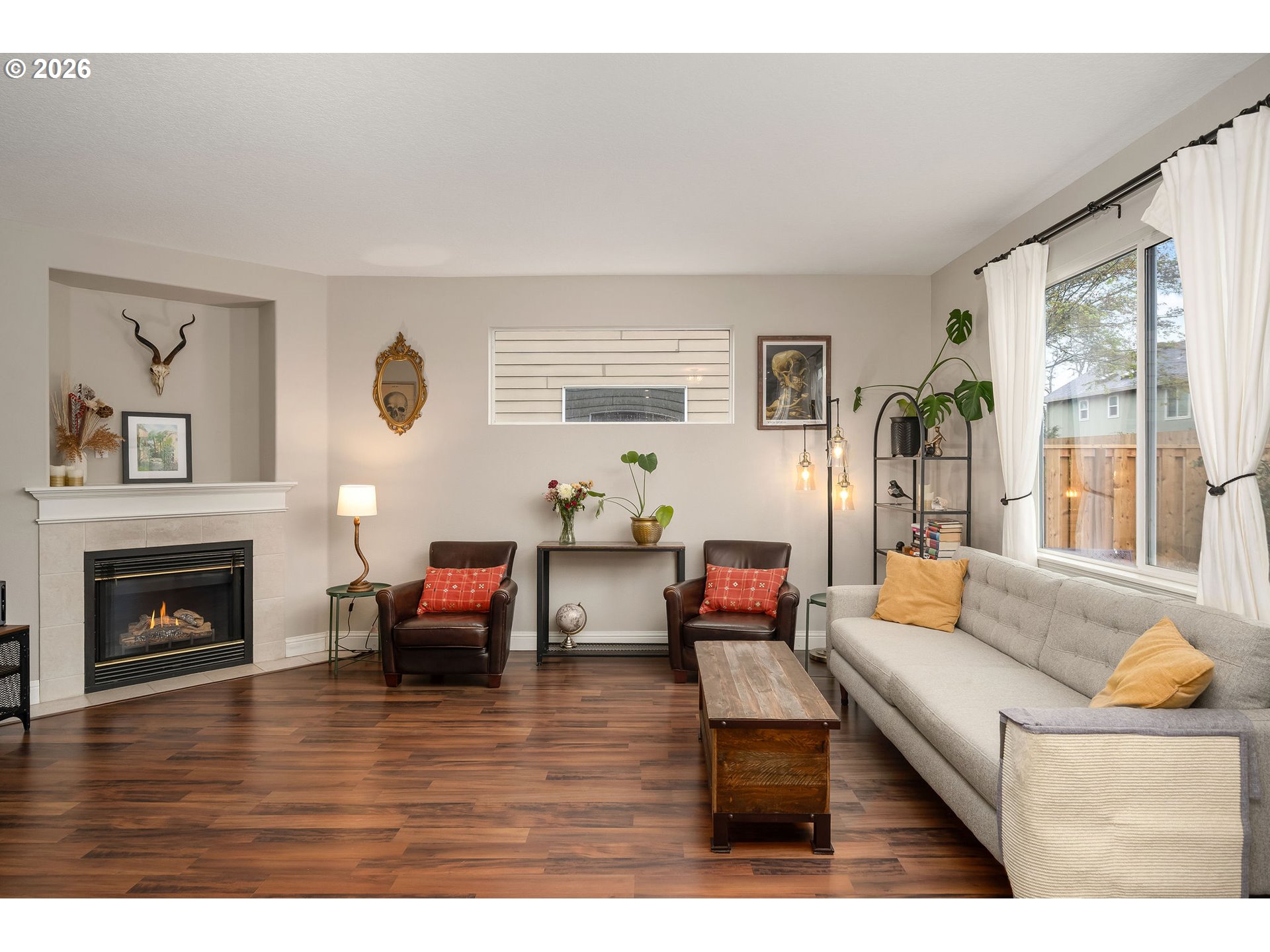 8330 Southwest Norfolk Lane Portland, OR 97224 - Photo 9 of 37 a living room with furniture and a fireplace