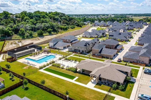 an aerial view of a pool patio patio and outdoor seating