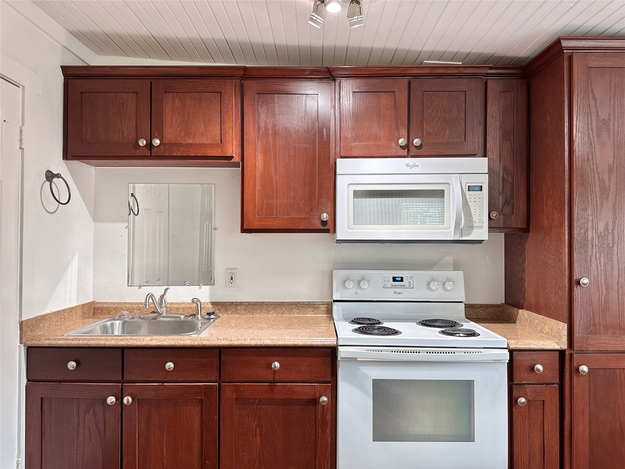 2103 East 16th Street, Unit ANNEX Austin, TX 78702 - Photo 12 of 23 a kitchen with sink a stove and cabinets