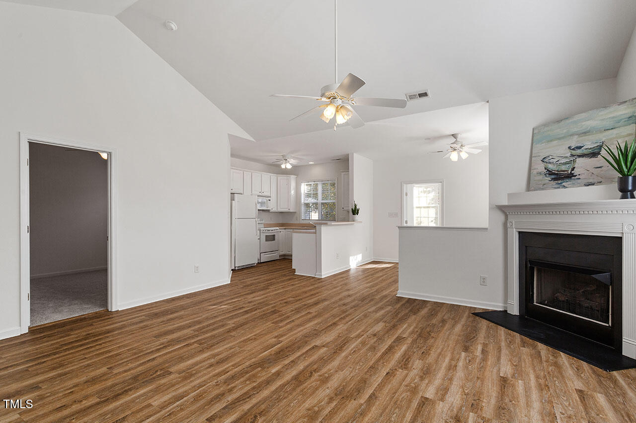 2739 Andover Glen Road Raleigh, NC 27604 - Photo 6 of 29 a view of a kitchen with furniture and a fireplace