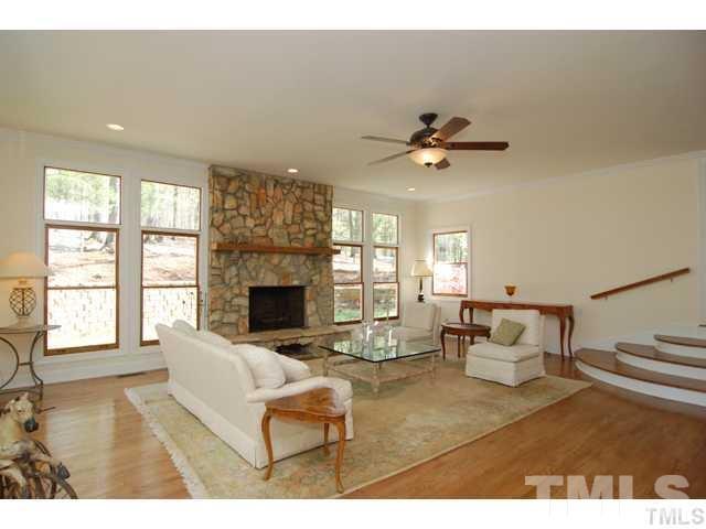 1061 Beaver Dam Road Chapel Hill, NC 27517 - Photo 16 of 19 a living room with furniture fireplace and a large window