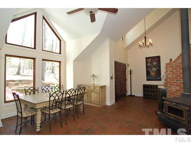 1061 Beaver Dam Road Chapel Hill, NC 27517 - Photo 18 of 19 a view of a dining room with furniture and a kitchen