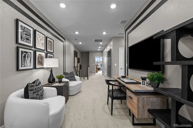 a bedroom with a large bed chandelier and a window