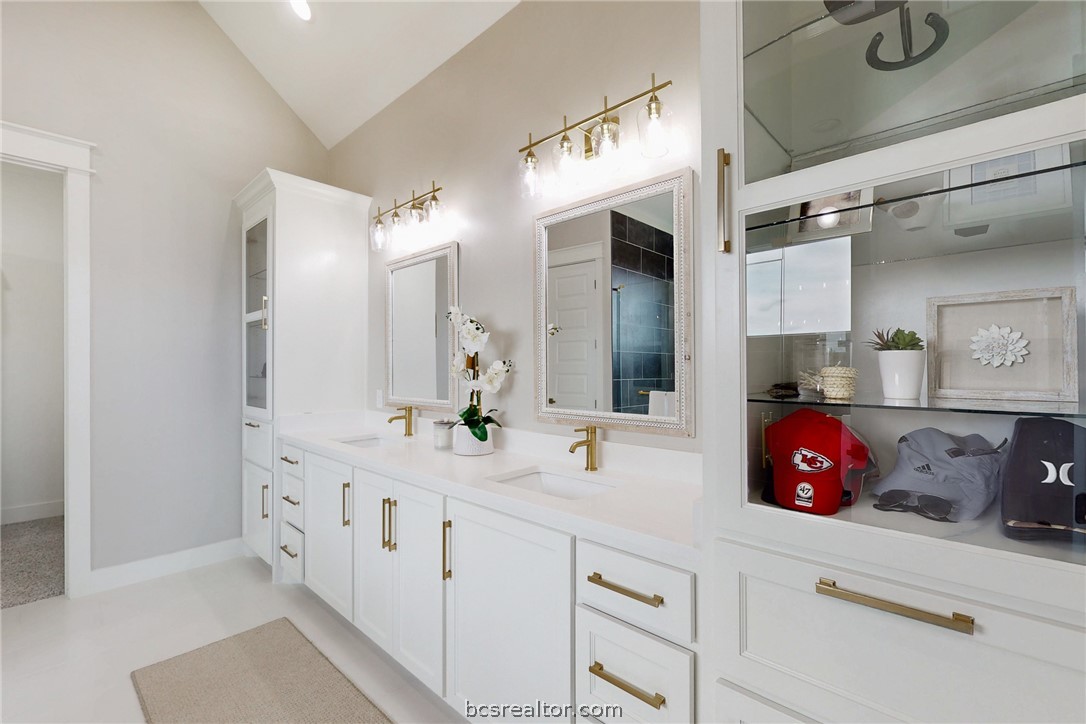 13504 Hudson Farms Road Hearne, TX 77859 - Photo 25 of 48 Custom shelving, tile floors, lots of light, and vaulted ceilings make this sophisticated retreat relaxing, and inviting.