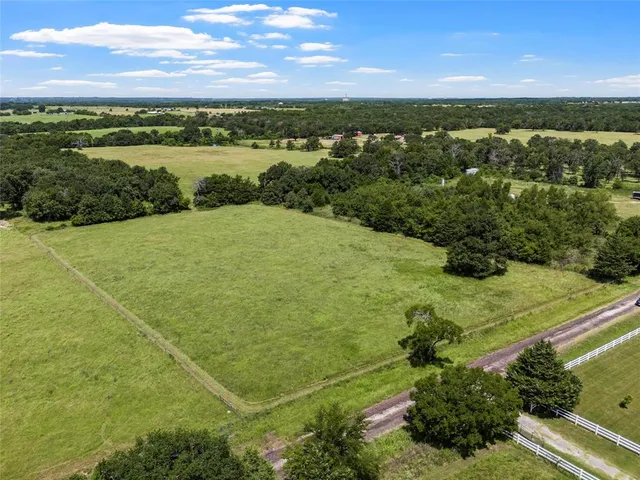 a view of a yard with an outdoor space