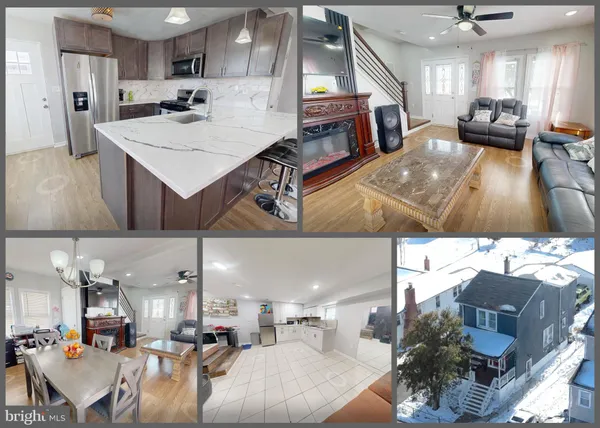 a living room with fireplace furniture and a kitchen view