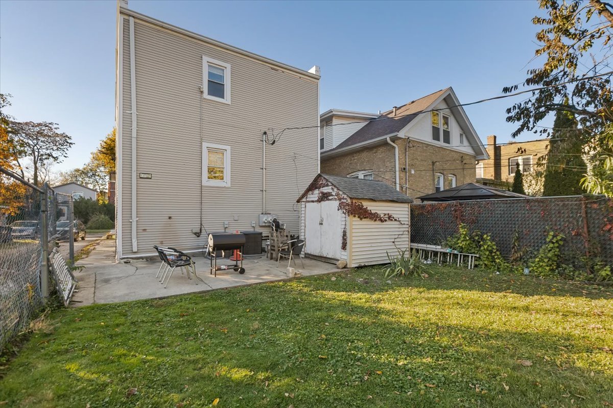 1213 Darrow Avenue Evanston, IL 60202 - Photo 11 of 16 a view of a house with a yard and sitting area