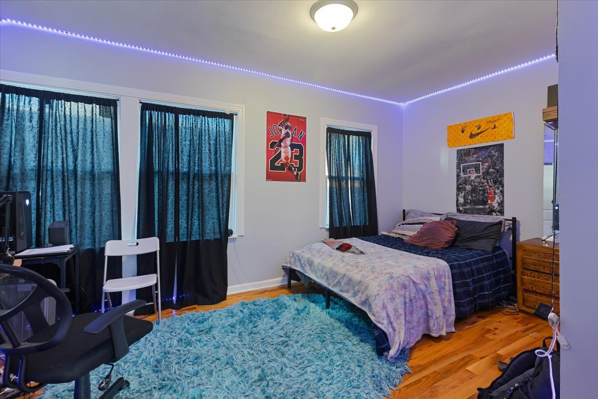 1213 Darrow Avenue Evanston, IL 60202 - Photo 5 of 16 a bedroom with a bed and furniture