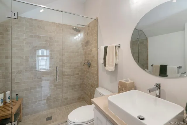 a bedroom with two beds and painting on the wall