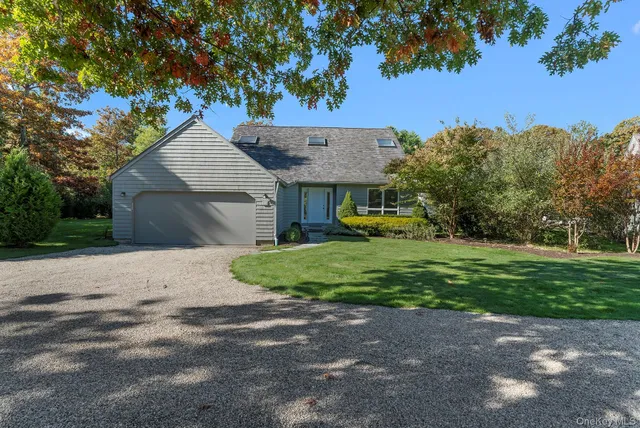 a large kitchen with granite countertop a large counter top furniture and stainless steel appliances
