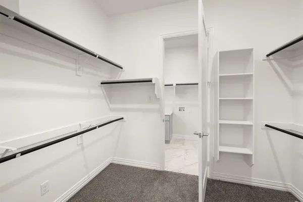 a view of an empty walk in closet