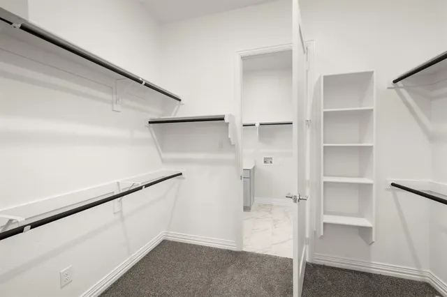 a view of an empty walk in closet