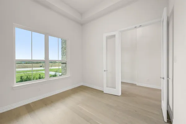 a view of an empty room with a window