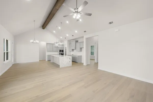 a view of a kitchen with furniture and a kitchen