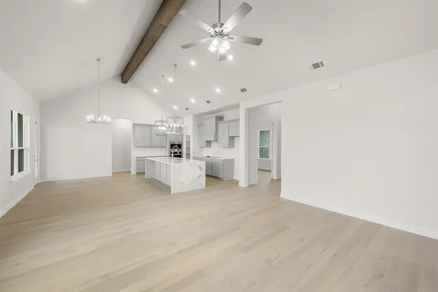 a view of a kitchen with furniture and a kitchen